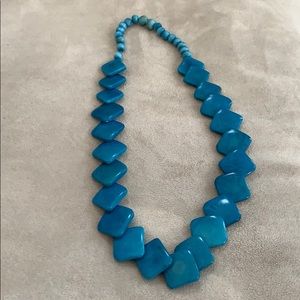 Tagua nut necklace in turquoise made in Ecuador.